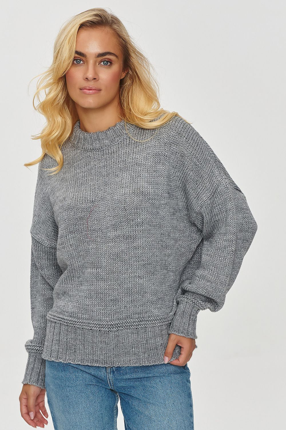 Luxury Women's loose fit Makadamia sweater showcasing soft acrylic blend fabric, perfect for elegant casual wear.