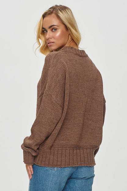 Stylish Makadamia women's loose knit sweater, featuring ribbed cuffs and hem for adjustable fitting, perfect for adding warmth and luxury to any wardrobe.