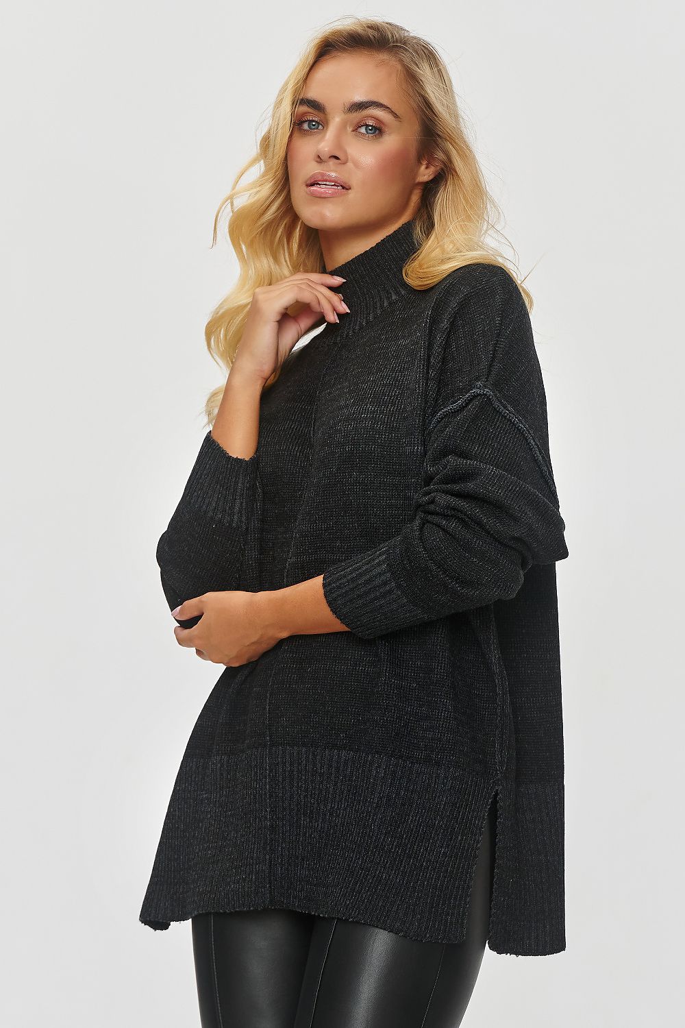 Makadamia Women's Oversized Turtleneck Sweater in Warm Melange, featuring side slits and a relaxed fit for luxurious comfort.