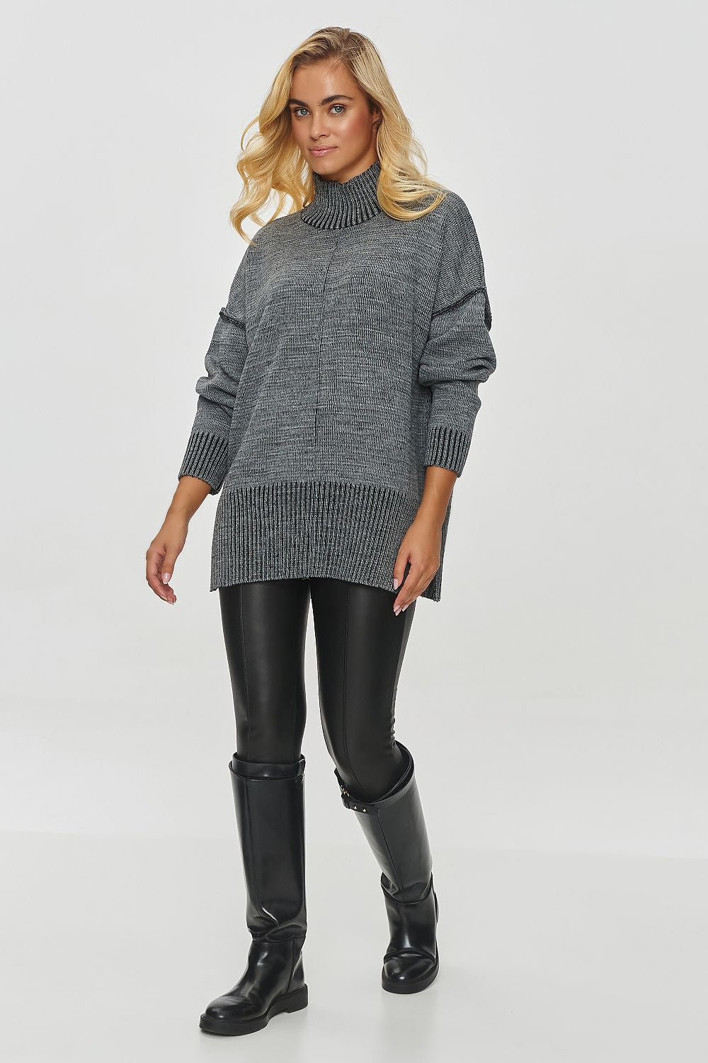 Close-up of Makadamia Women's Oversized Turtleneck Sweater in elegant melange knit, showcasing the ribbed details and relaxed fit for a chic winter look.