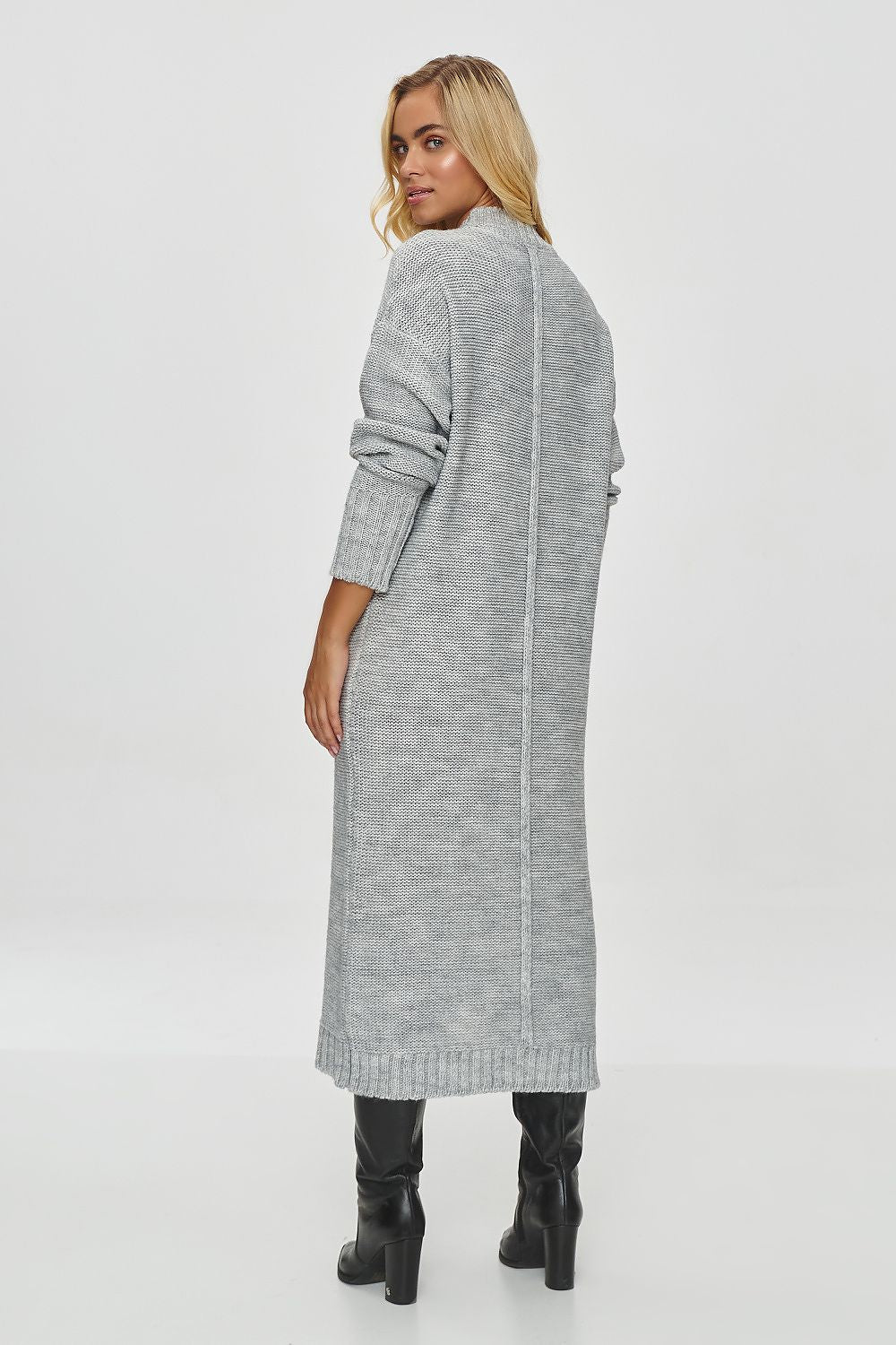 Sophisticated Makadamia Women's Long Sweater Dress showcasing a minimalistic design with a delicate vertical line, ideal for chic winter attire.