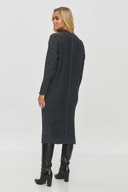 Stylish Makadamia Long Sweater Dress displayed on a mannequin, highlighting its warm, minimalistic design, ideal for sophisticated winter wear.