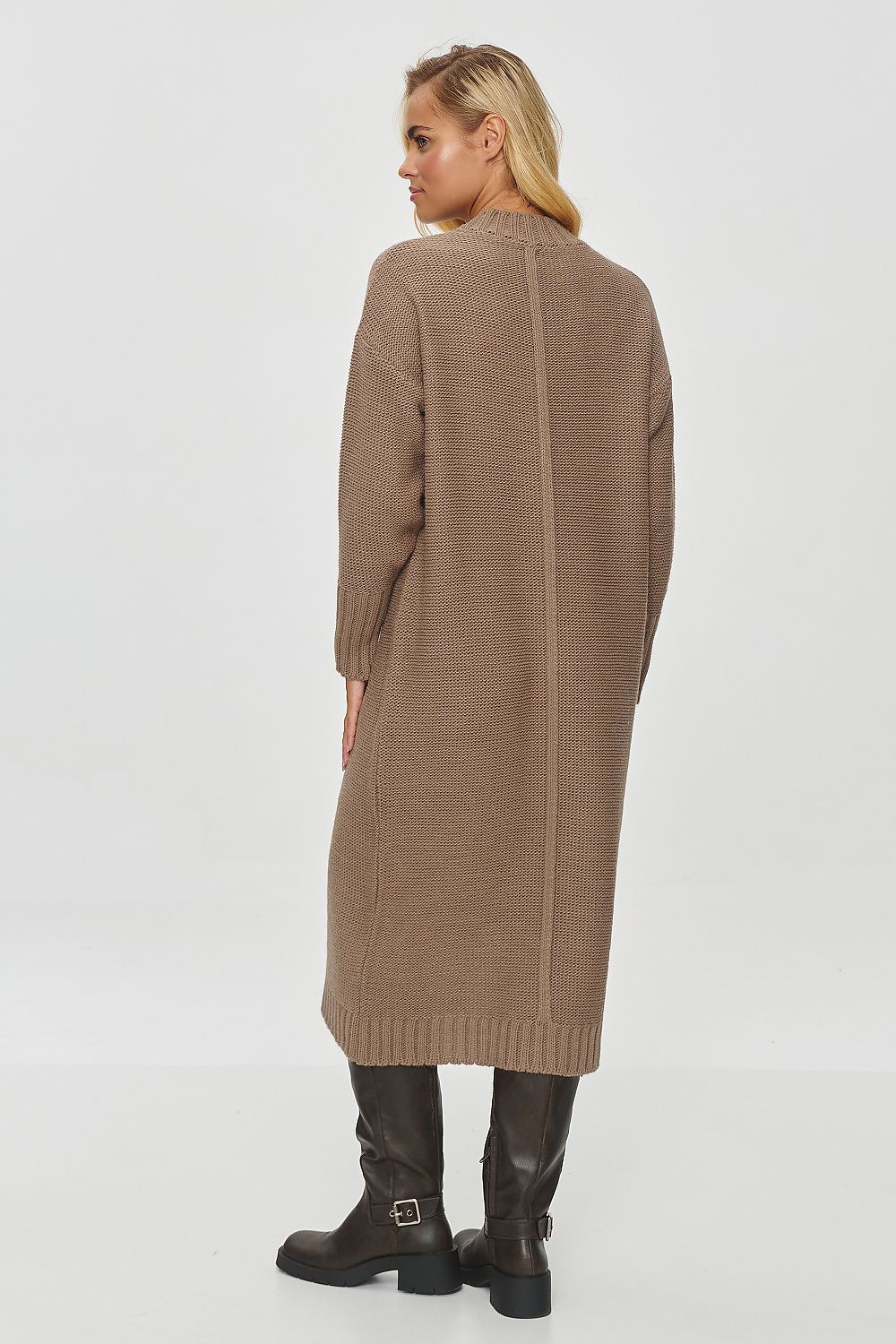 Front view of the Makadamia Women's Long Sweater Dress, elegantly styled with high boots, reflecting luxurious winter fashion.
