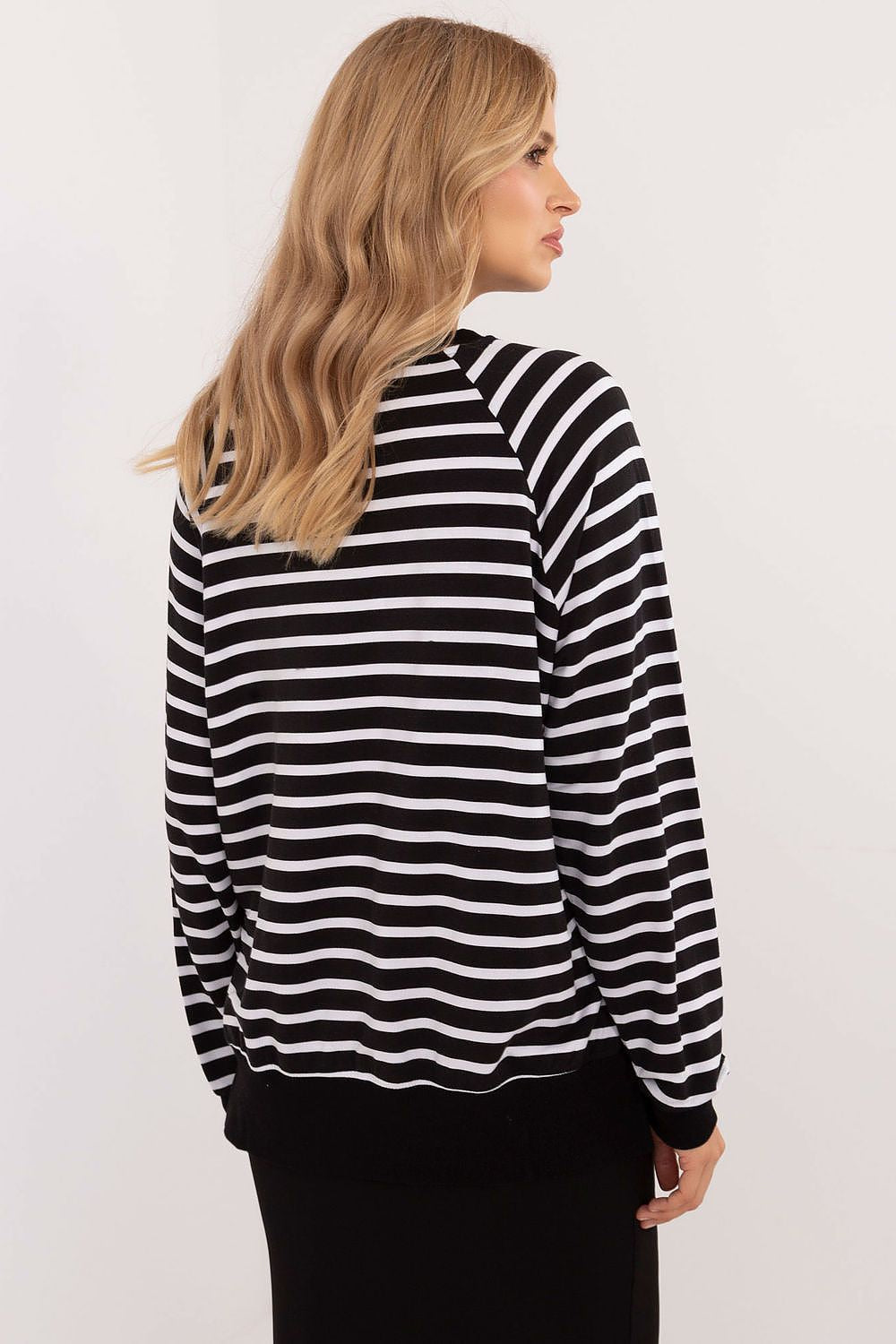Close-up of the comfortable fabric of Relevance's elegant striped blouse, made predominantly of soft micro modal and spandex for a gentle touch against the skin.