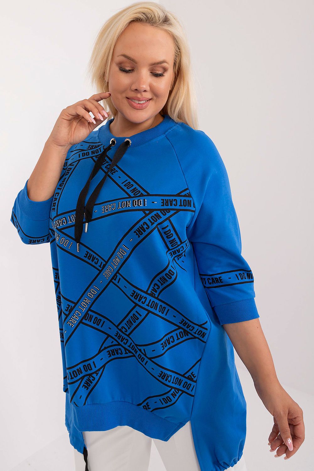 Chic 3/4 sleeve plus size cotton-blend blouse from Relevance, showcasing an elegant asymmetrical silhouette with fashionable rhinestone accents for a touch of luxury in everyday attire.