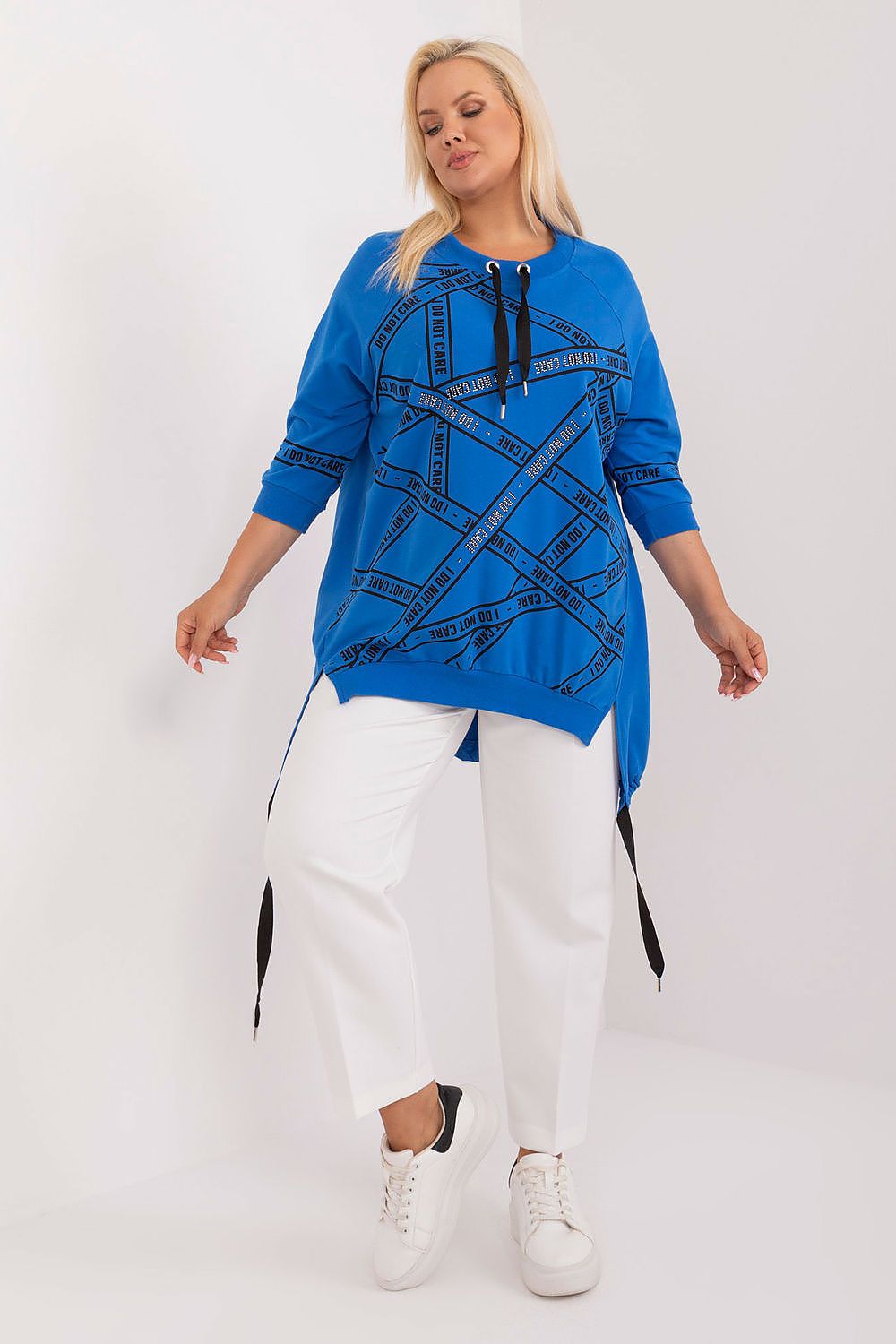 Fashion-forward plus size blouse in cotton-spandex by Relevance, featuring an asymmetrical design and eye-catching rhinestone details, perfect for adding flair to your wardrobe.