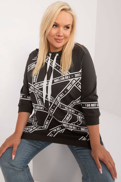 Trendy plus size blouse by Relevance featuring an asymmetrical silhouette, crafted from breathable cotton-spandex with decorative rhinestone detail.