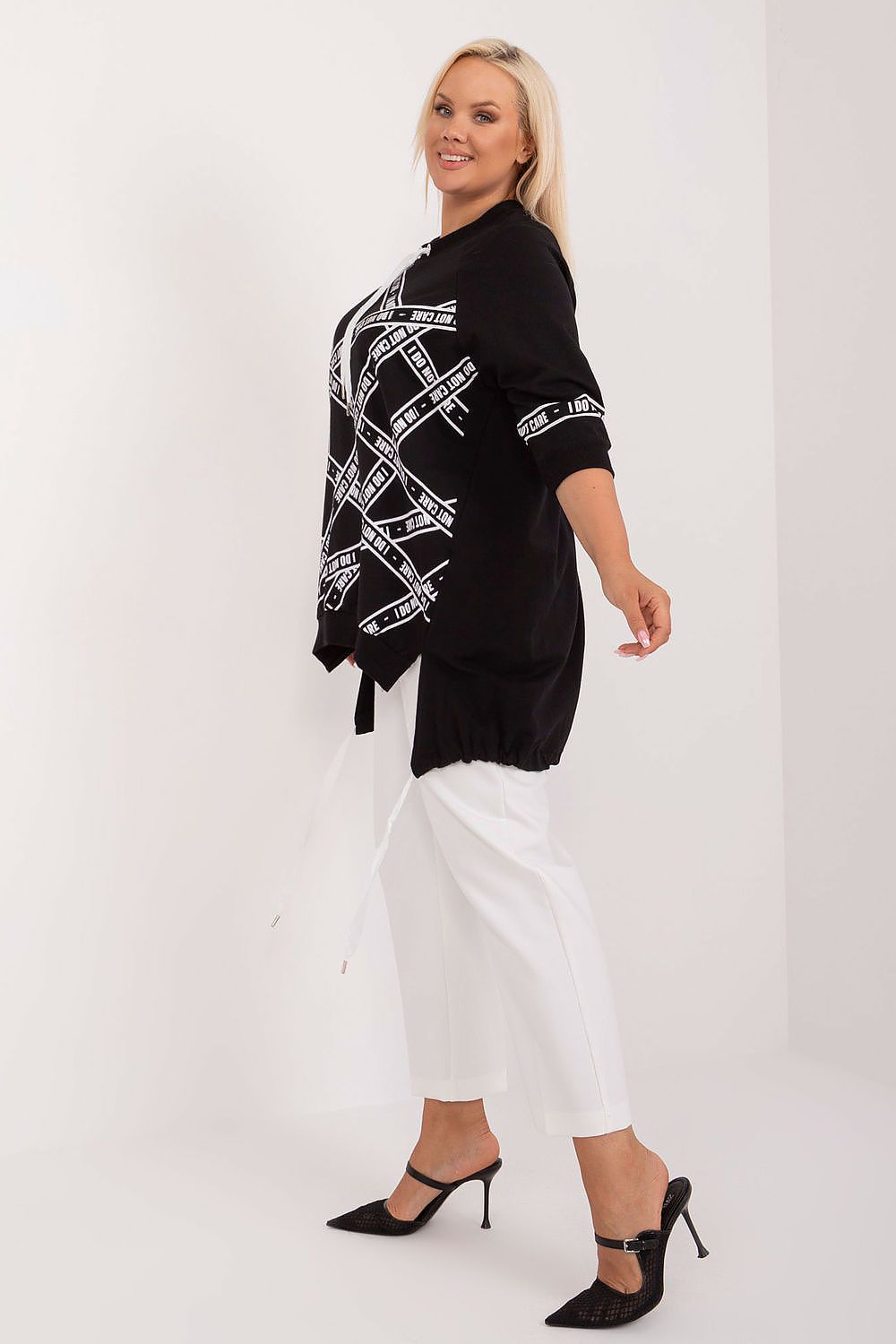 Comfortable yet trendy cotton-spandex blouse from Relevance, designed for curvy shapes with decorative rhinestones and 3/4 sleeves, blending elegance and ease.