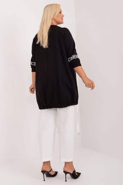 Chic everyday blouse for plus sizes by Relevance, featuring an asymmetrical cut, 3/4 sleeves, and enchanting rhinestone embellishments for a timeless look.