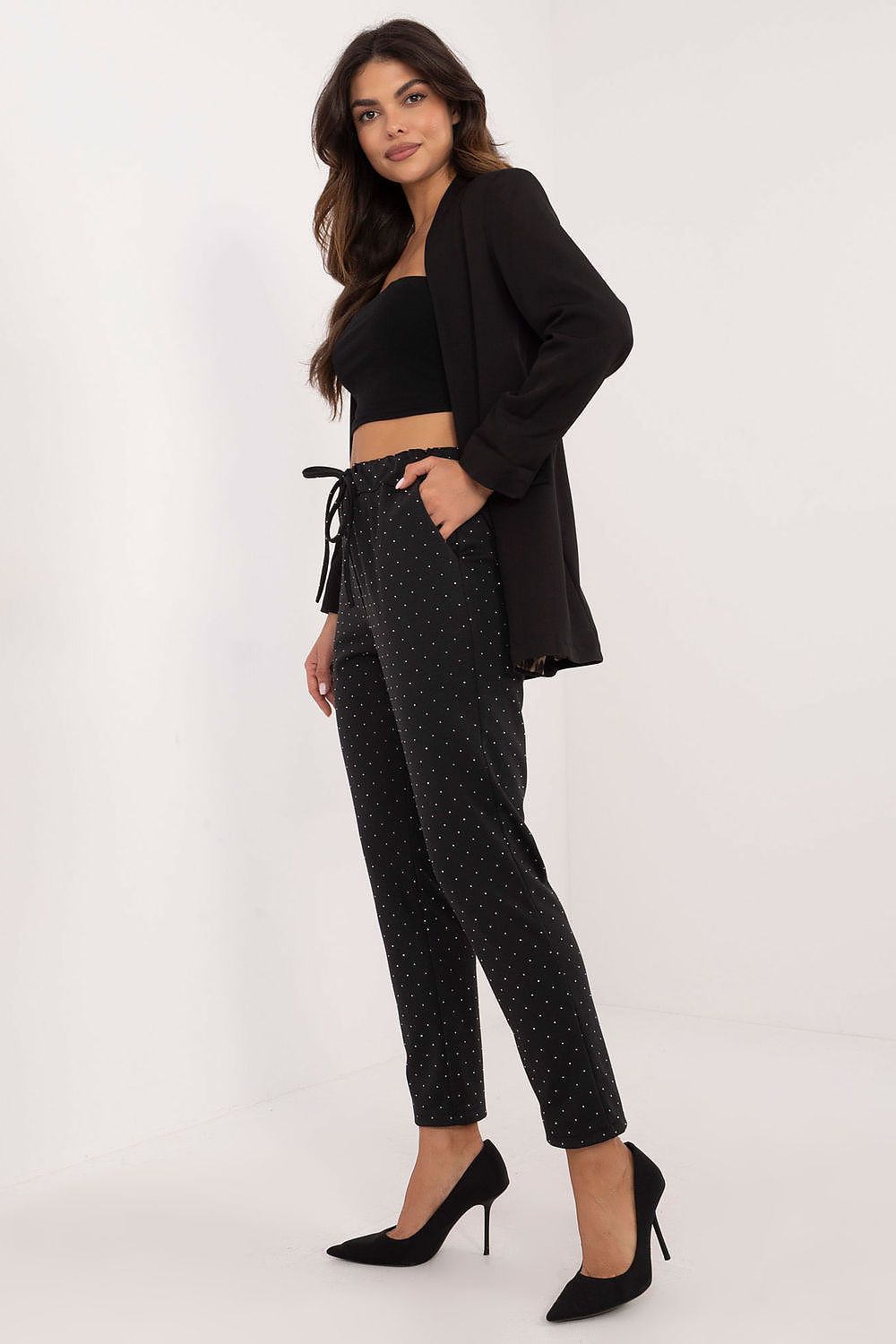 Rear view of Italy Moda's luxury black tracksuit trousers with rhinestones, emphasizing the flattering silhouette and high fashion appeal.