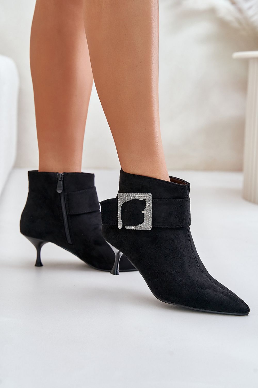 Chic eco-suede stiletto heel boots with a sophisticated pointed toe design from Step in Style, complete with a striking large buckle detail.