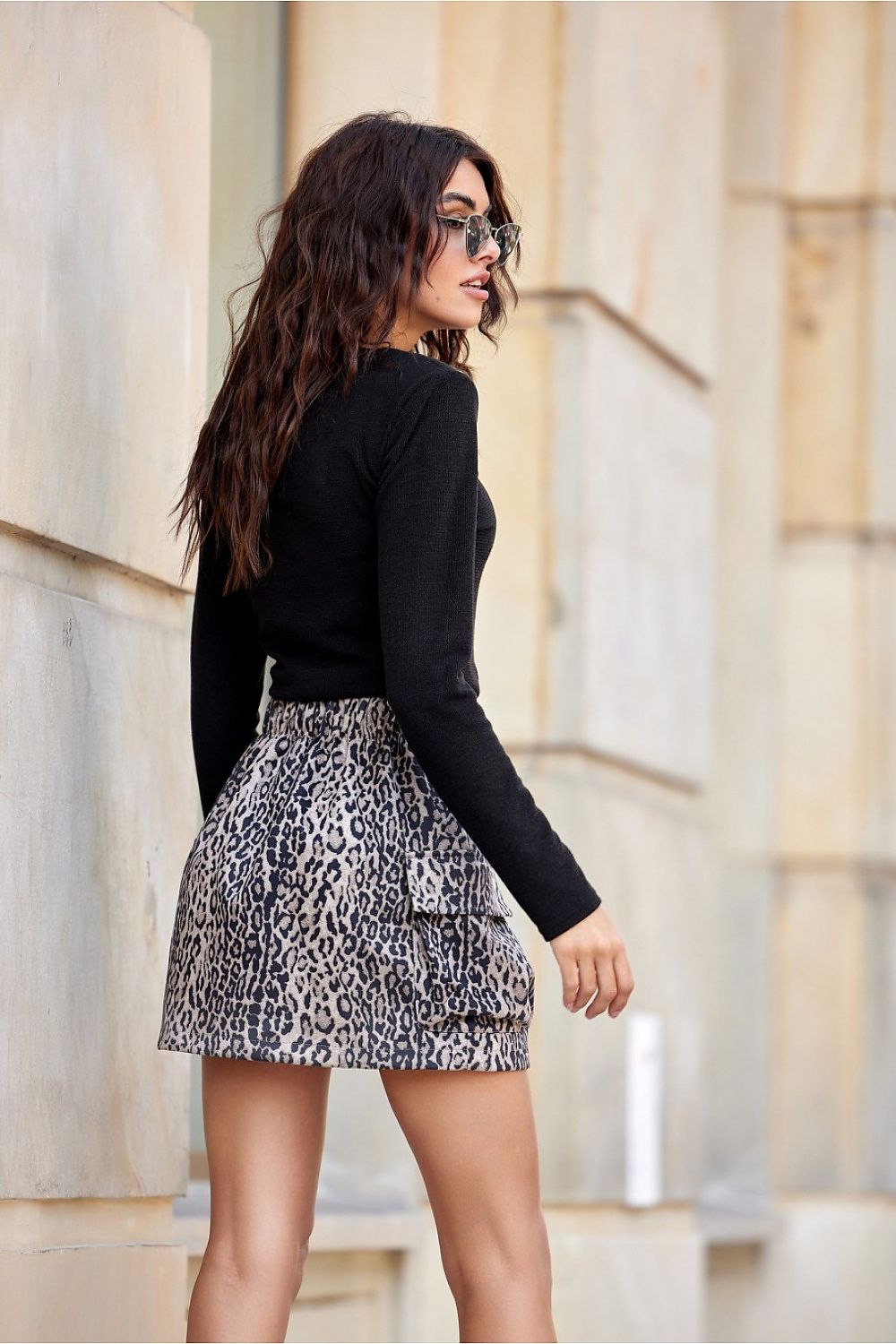 Model wearing the stylish Lara Mini Skirt by Roco Fashion, featuring elastic back for a flattering fit and chic cargo pockets, ideal for versatile dressing.