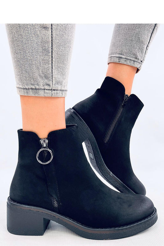Close-up view of Inello Women's nubuck heel boots showcasing the chic zipper closure and luxurious soft fur lining.