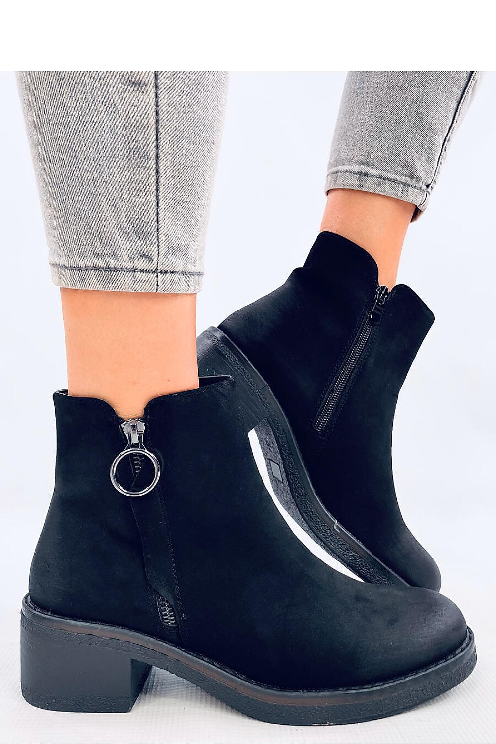 Close-up view of Inello Women's nubuck heel boots showcasing the chic zipper closure and luxurious soft fur lining.