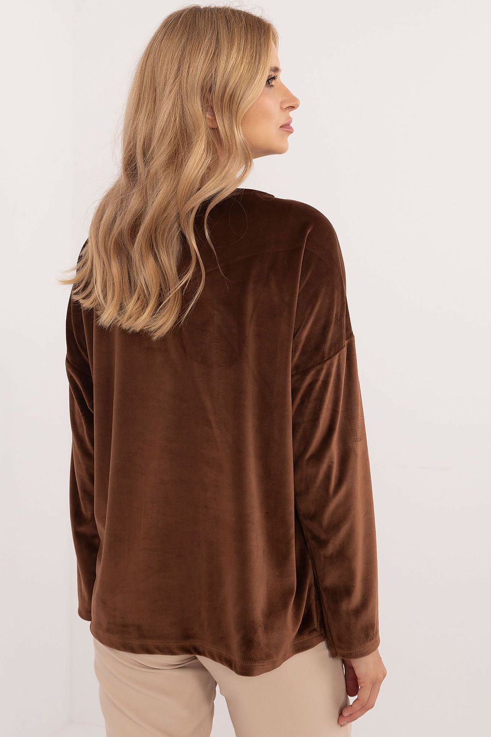 Close-up of the decorative butterfly ties on the velour blouse by Italy Moda, highlighting its unique and sophisticated style for everyday wear.