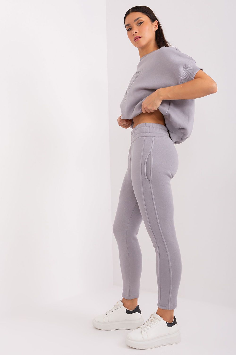 Close-up of the tapered pants from Luxury Women's Insulated Casual Sweatshirt Set by Factory Price, highlighting the high waist and elastic waistband for ultimate comfort.