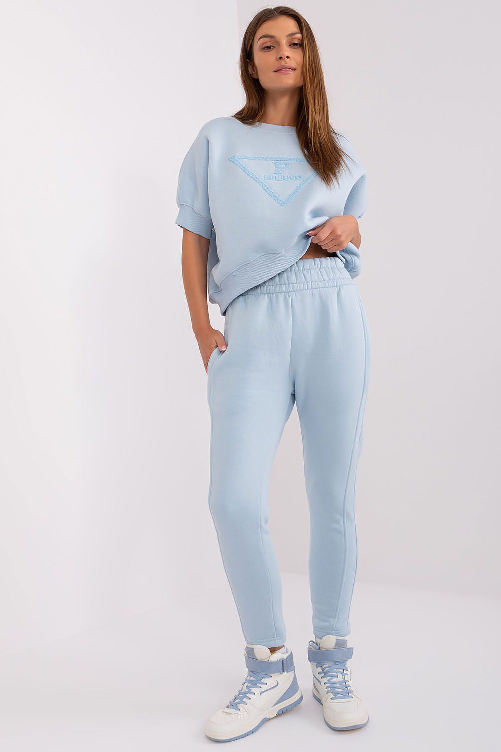 Luxury women's insulated casual sweatshirt set by Factory Price featuring a stylish sweatshirt and tapered pants, perfect for colder days.