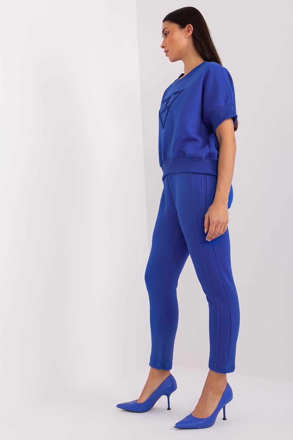 Stylish side view of the women's tapered pants featuring an elastic waistband for a sophisticated look, created by Factory Price.