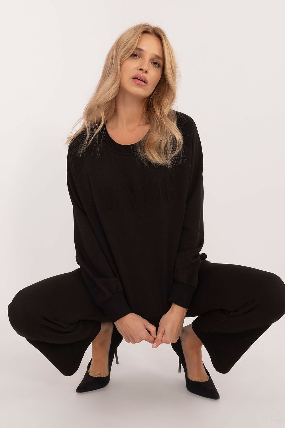 Luxury women's casual tracksuit set featuring a stylish cotton/polyester blend sweatshirt and high waist pants by Factory Price, perfect for everyday wear.