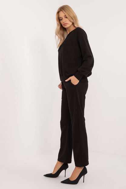 Close-up of the elegant sweatshirt from the luxury women's tracksuit set by Factory Price, showcasing its smooth fabric and original design.