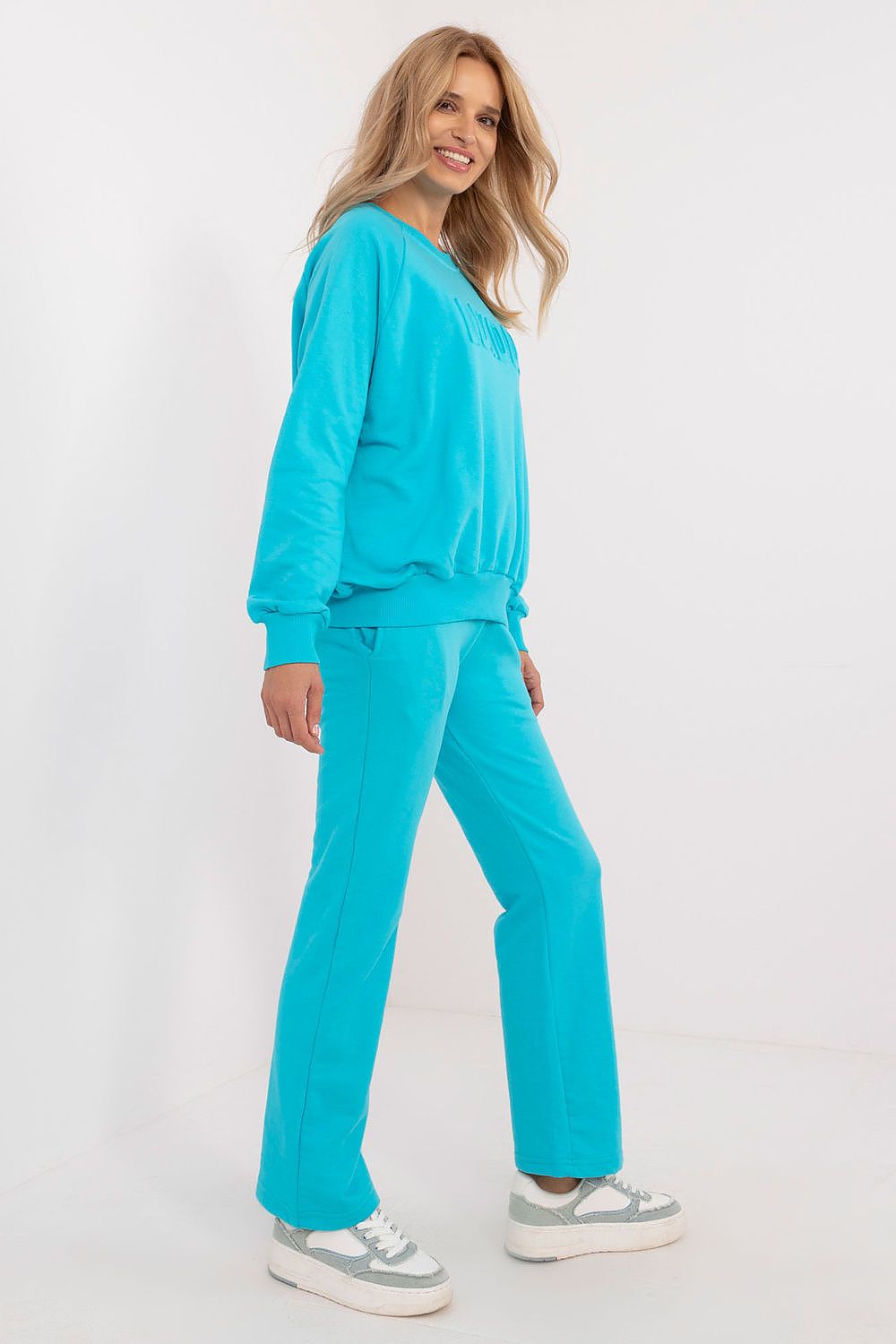 Model wearing the luxury women's casual tracksuit set by Factory Price, demonstrating the perfect blend of style and comfort in everyday fashion.