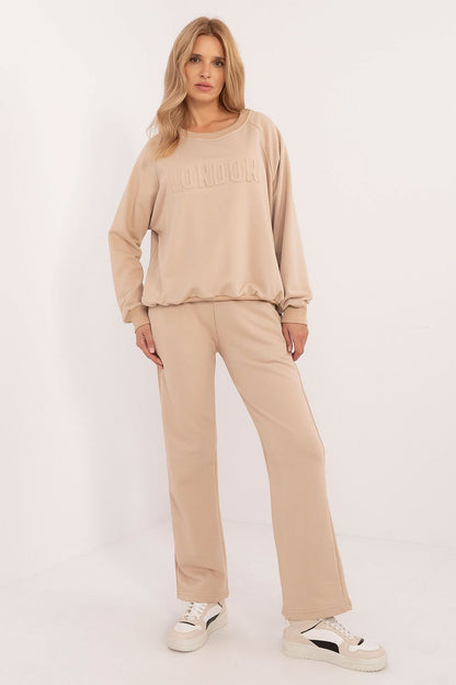 Elegant women's tracksuit display, highlighting the high waist pants and long sleeve sweatshirt, perfect for stylish everyday wear, by Factory Price.