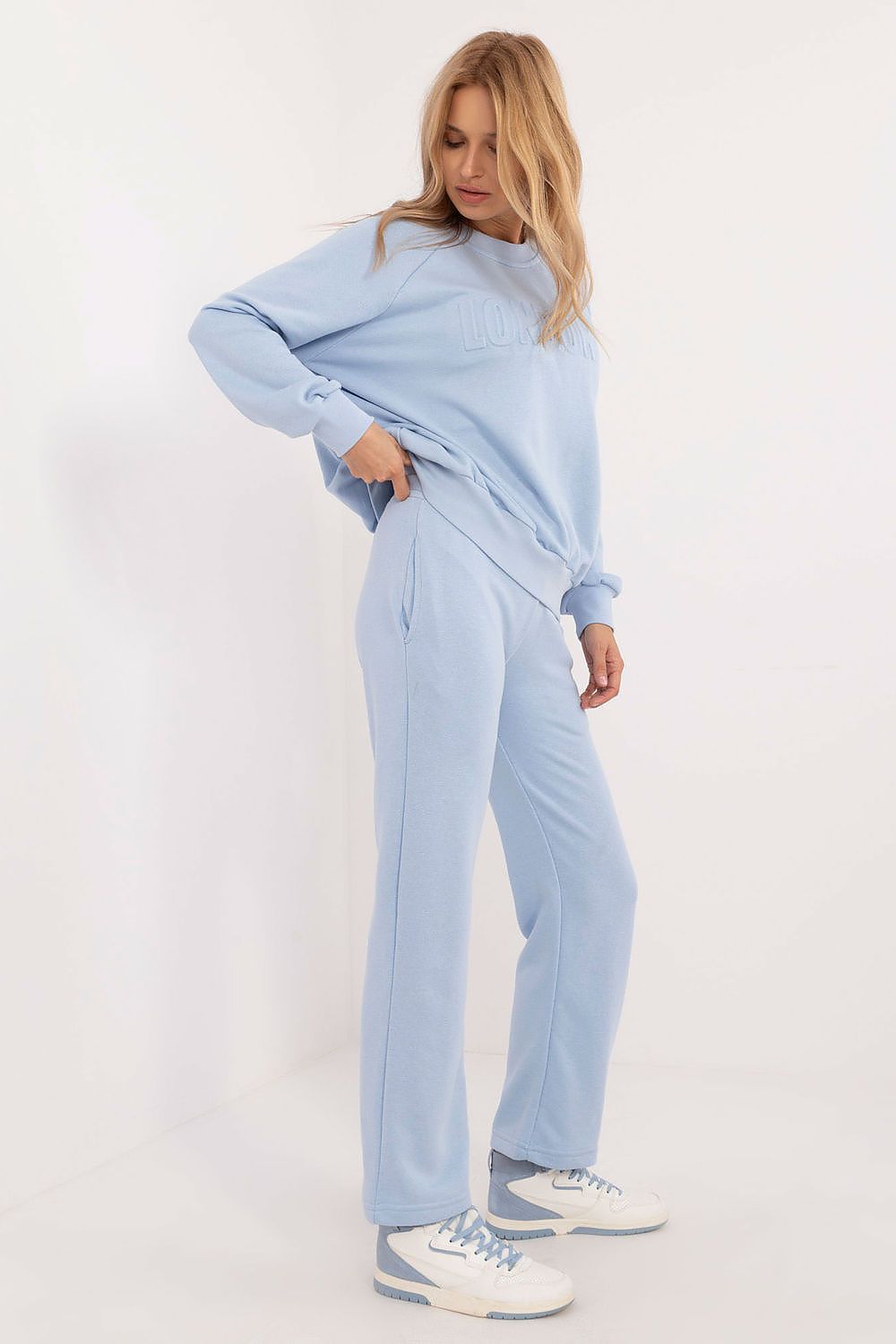 Elegant model wearing the Luxury Women's Casual Tracksuit Set with long sleeves and round neckline, perfect for casual outings by Factory Price.