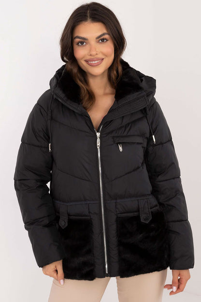 MBM luxury women's quilted jacket displayed on a model, demonstrating its elegant design and functional hood in a chilly autumn setting.