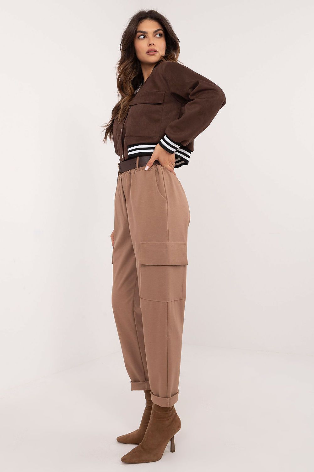 Side view of Och Bella Women's High Rise Cargo Trousers highlighting the tapered legs and practical side slip pockets, a blend of functionality and elegance.