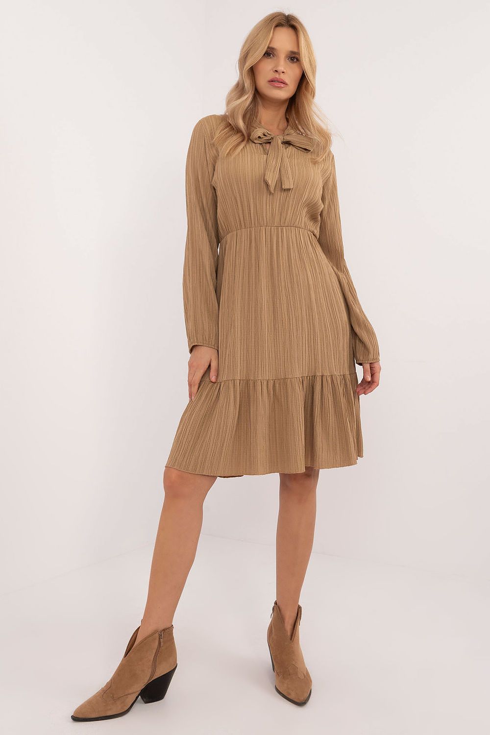 Elegant flared daydress by Och Bella, made from a luxurious polyester-spandex blend, featuring a ruffled hem and stylish tied neckline, ideal for casual and work occasions.