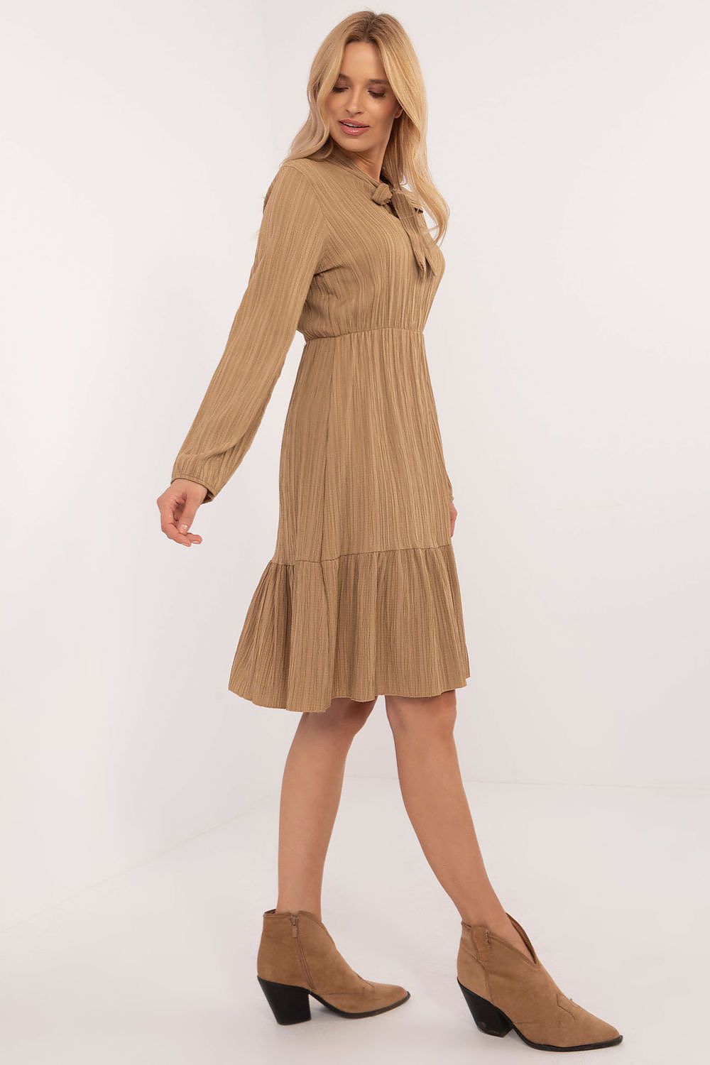 Elegant flared daydress by Och Bella, showcasing a ruffled hem and tied neckline, made from a luxurious polyester-spandex blend.