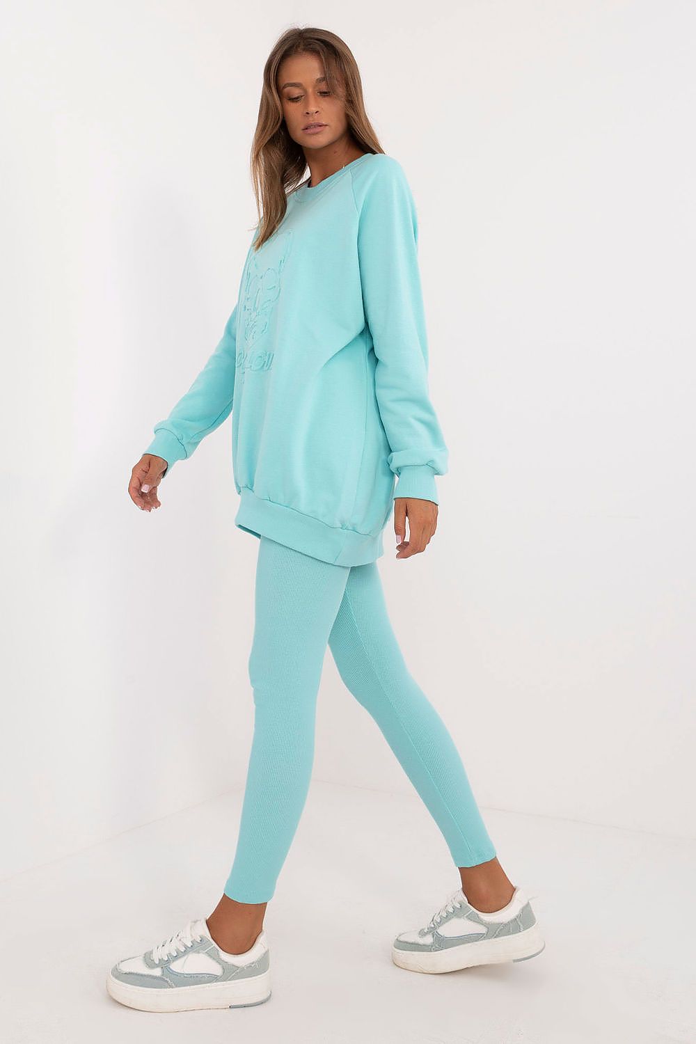 Full view of the Luxury Women's leggings and sweatshirt set, emphasising casual elegance with tapered legs and an embossed sweatshirt, created by Factory Price.