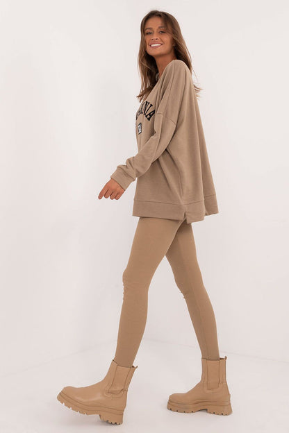 Chic women's casual sweatshirt detailing modern print, part of the luxurious legging set by Factory Price, designed for comfort and fashion.