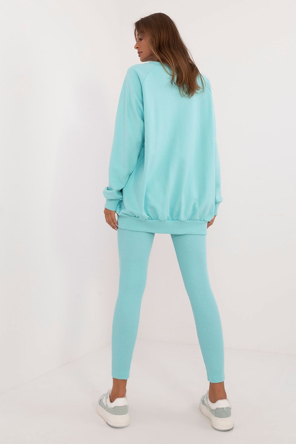 Luxury Women's Leggings and Sweatshirt Set by Factory Price featuring an embossed design in high-quality cotton-spandex blend, highlighting comfort and elegance.