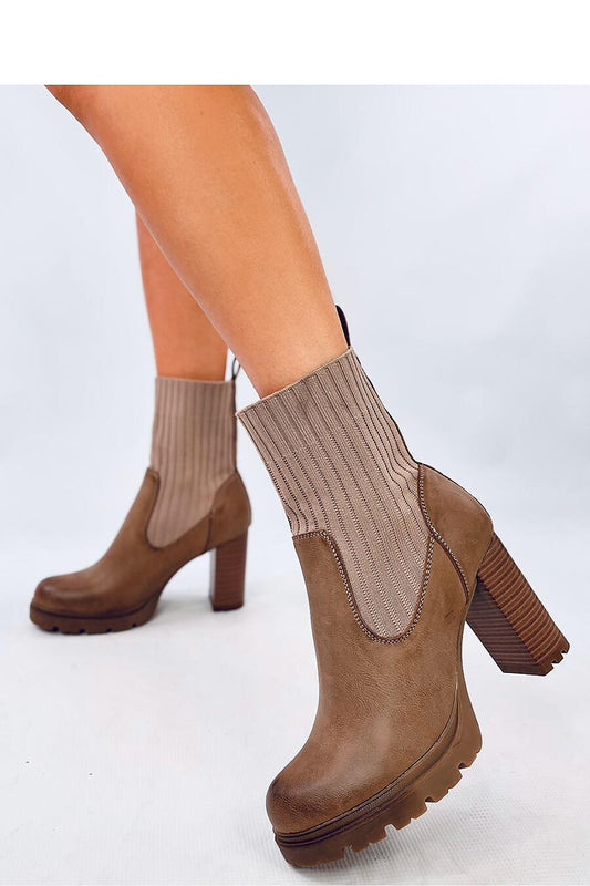Elegant Inello women's heel boots with a 9.5 cm heel and 2 cm platform, featuring a unique sock style in luxurious ecological leather.