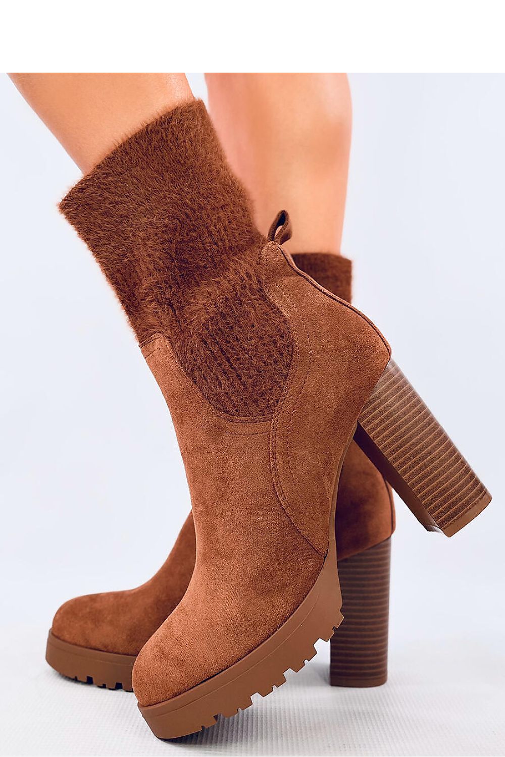 Luxury suede ankle boots by Inello featuring a 10cm heel and elastic cuff, available in EU sizes 36 to 41, perfect for sophisticated style.