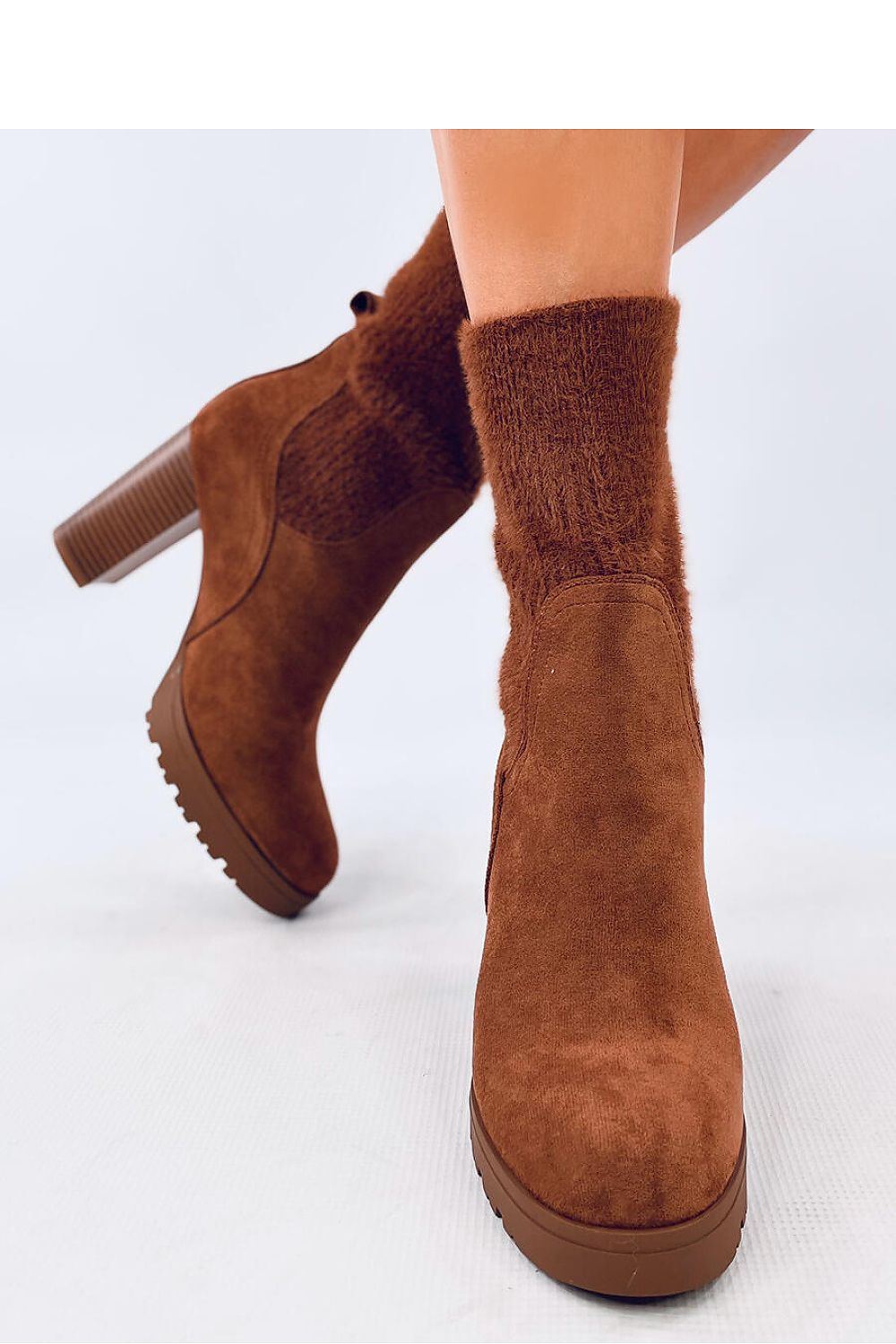 Elegant luxury suede ankle boots by Inello featuring a 10cm heel and elastic cuff, perfect for stylish women's footwear.