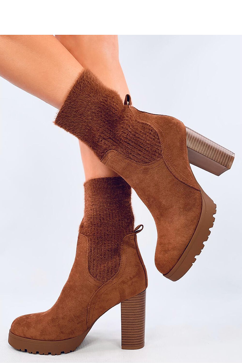 Close-up of Inello luxury suede ankle boots with 10cm heel and elegant elastic cuff detail, designed for comfort and style.