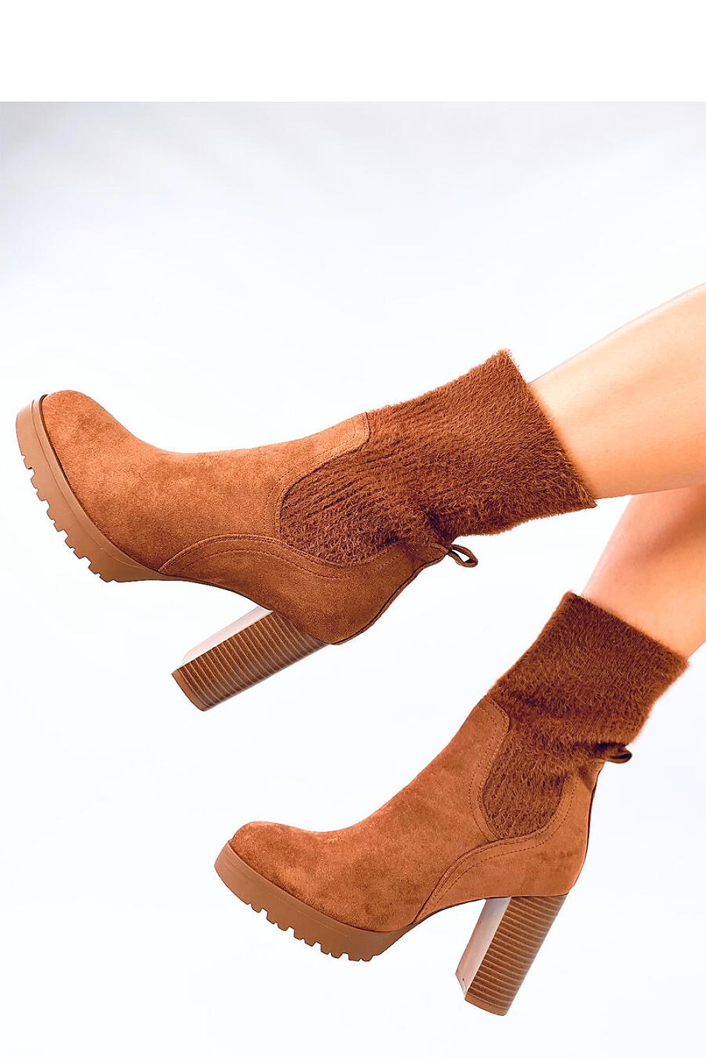 Chic and stylish Inello women's ankle boots in soft suede with a 10cm heel and plush elastic cuff, ideal for fashionable outfits.