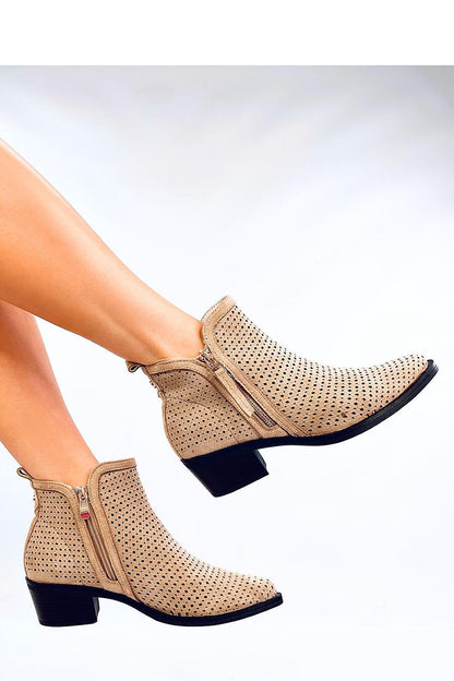 Luxurious ecological suede ankle boots for women from Inello, featuring trendy cutouts and a convenient zipper closure, offering both style and comfort.