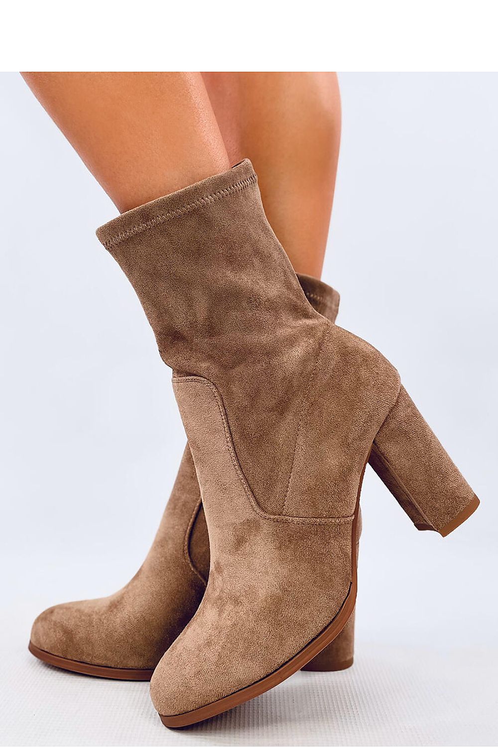 Close-up of the luxurious ecological suede texture on Inello's elegant ankle boots with a stylish rounded toe design.