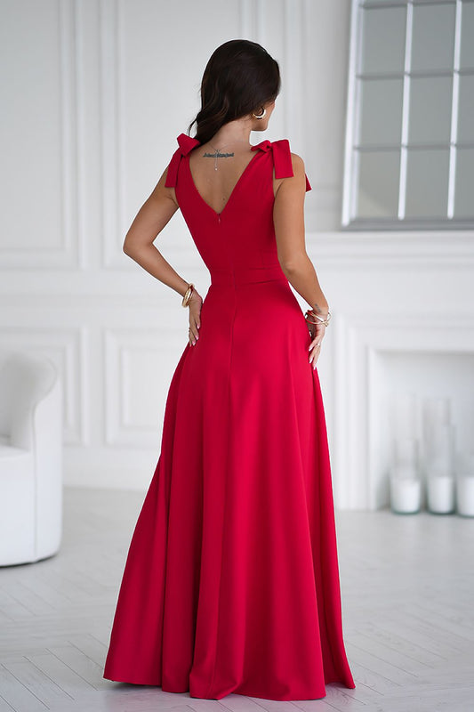 Sophisticated long dress by Bicotone featuring a seductive leg slit and elegant adjustable shoulder ties, perfect for formal events and special occasions.