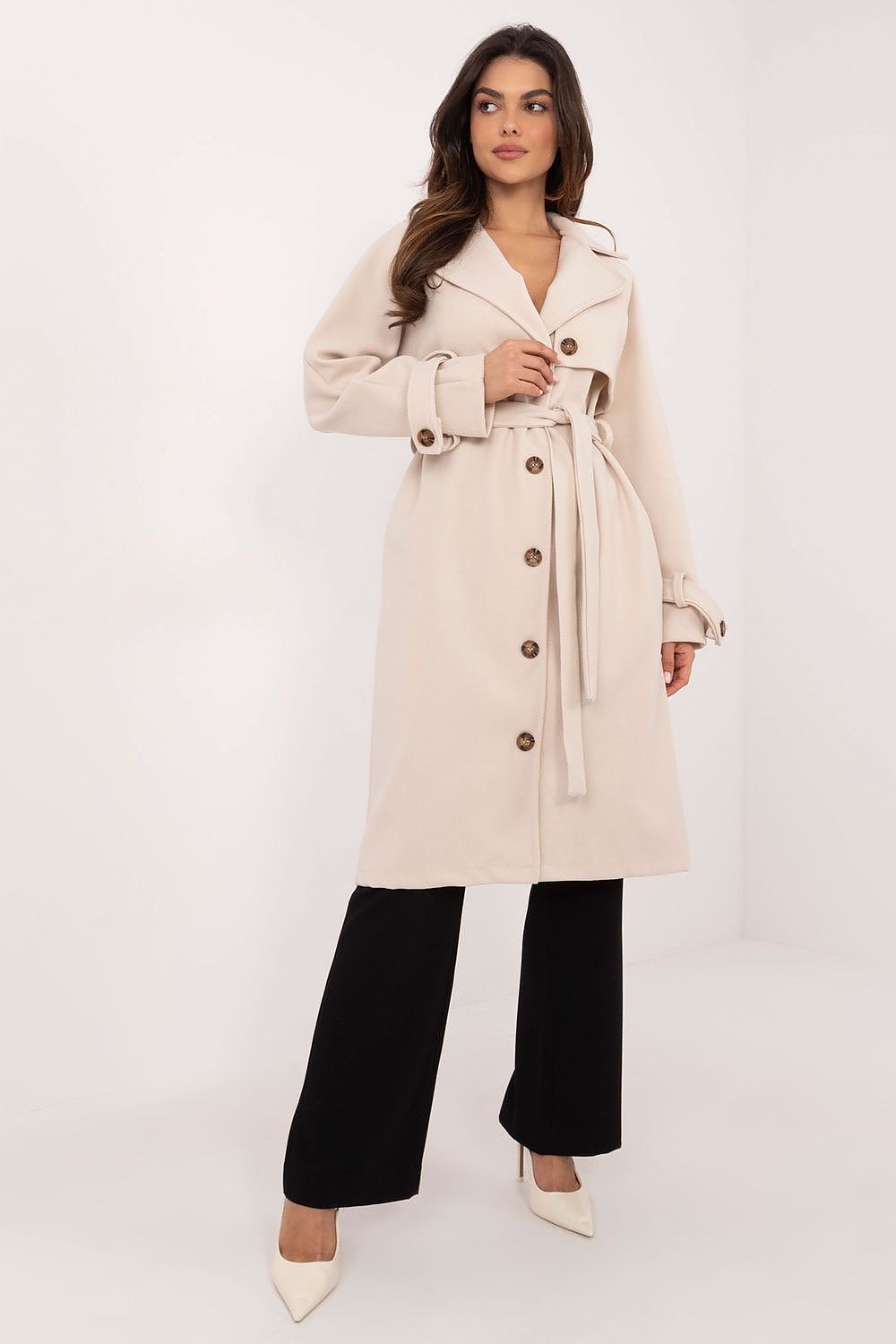 Side view of Och Bella's women's trench coat, highlighting its chic silhouette and practicality with slip pockets, perfect for stylish yet functional outerwear.