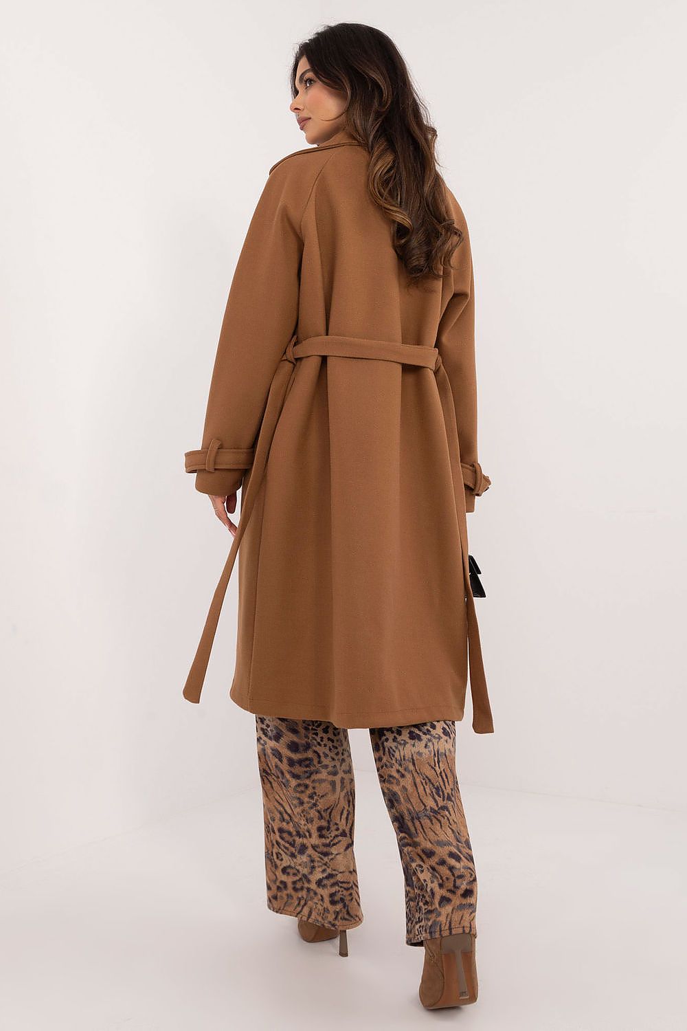 Versatile women's trench coat by Och Bella, designed for comfort with slip pockets and a timeless cut.