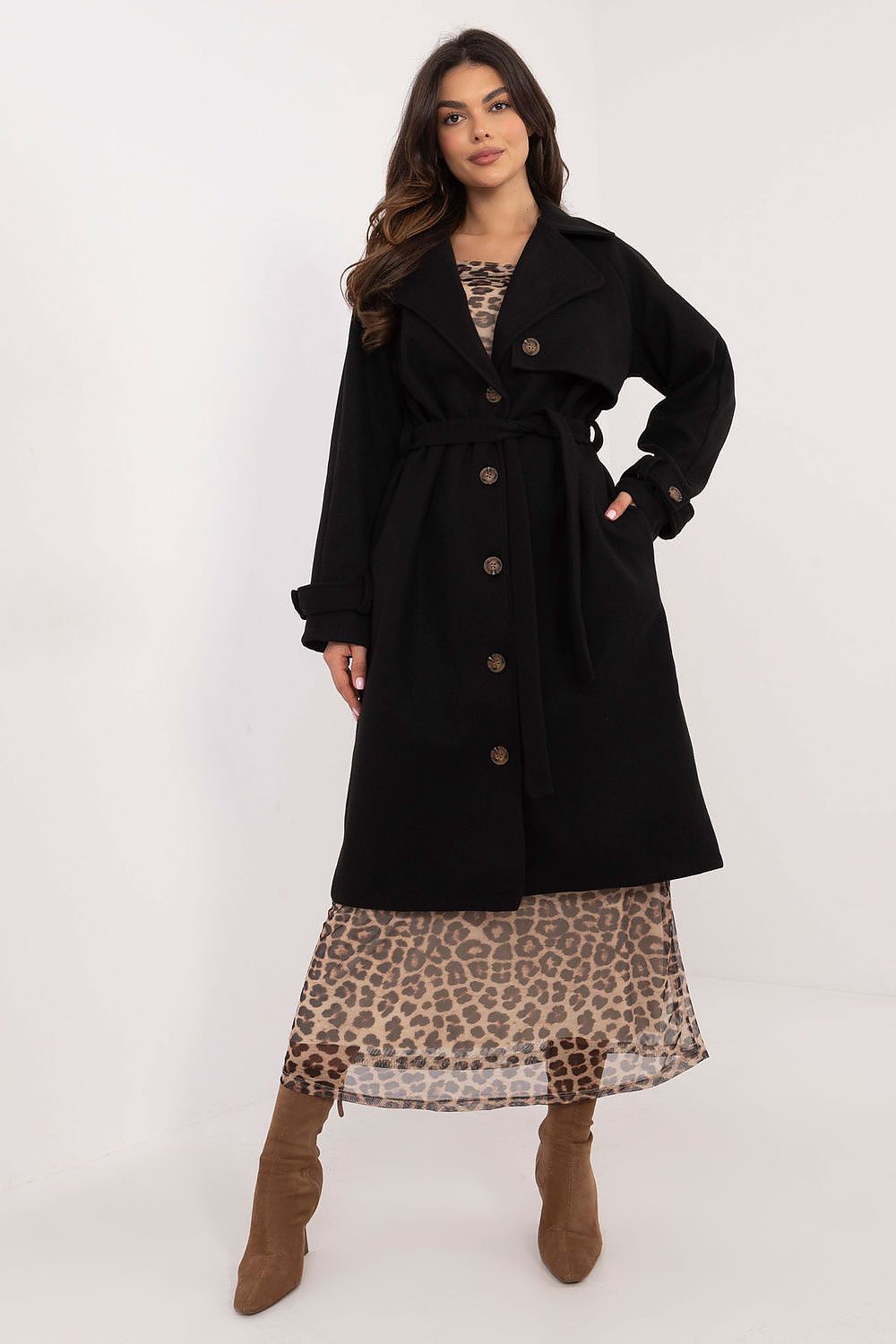 Model wearing Och Bella's chic women's trench coat in elegant styling, highlighting its knee-length and practical slip pockets for added convenience.