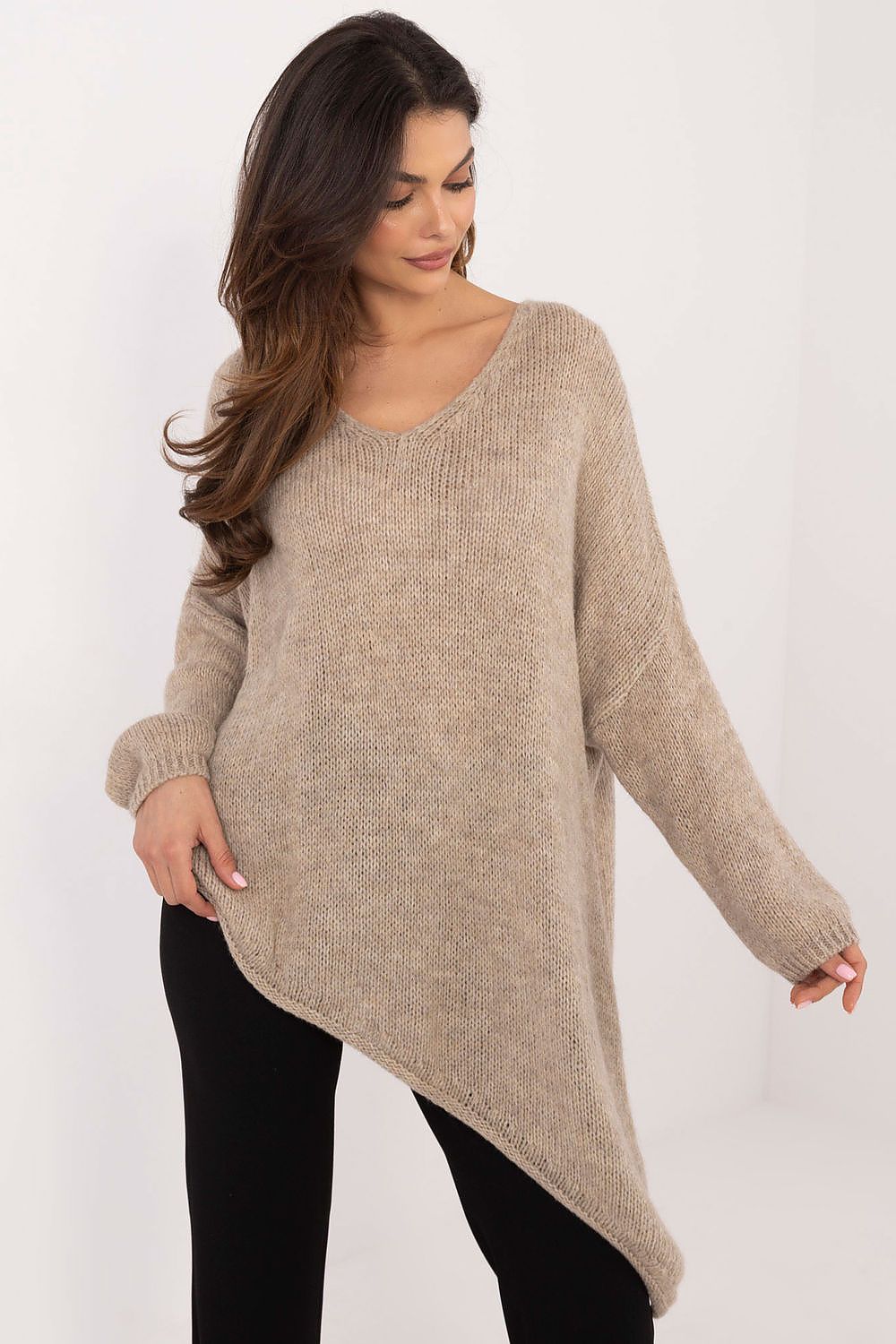 Model wearing Och Bella Women's Asymmetrical Hem Sweater, epitomising sophisticated style and warmth for colder days.