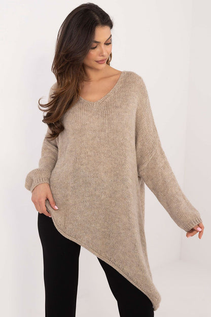 Model wearing Och Bella Women's Asymmetrical Hem Sweater, epitomising sophisticated style and warmth for colder days.