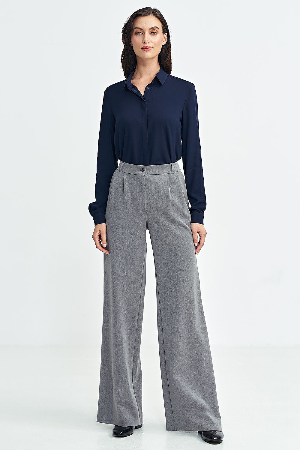 Close-up of Nife's luxurious long sleeve shirt for women, featuring refined stitching and subtle button details, perfect for versatile styling.