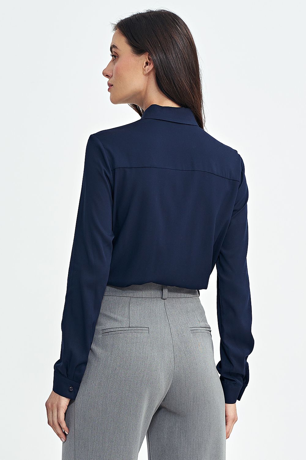 Nife women's elegant long sleeve shirt displayed on a mannequin, highlighting its elegant silhouette and comfortable viscose material.