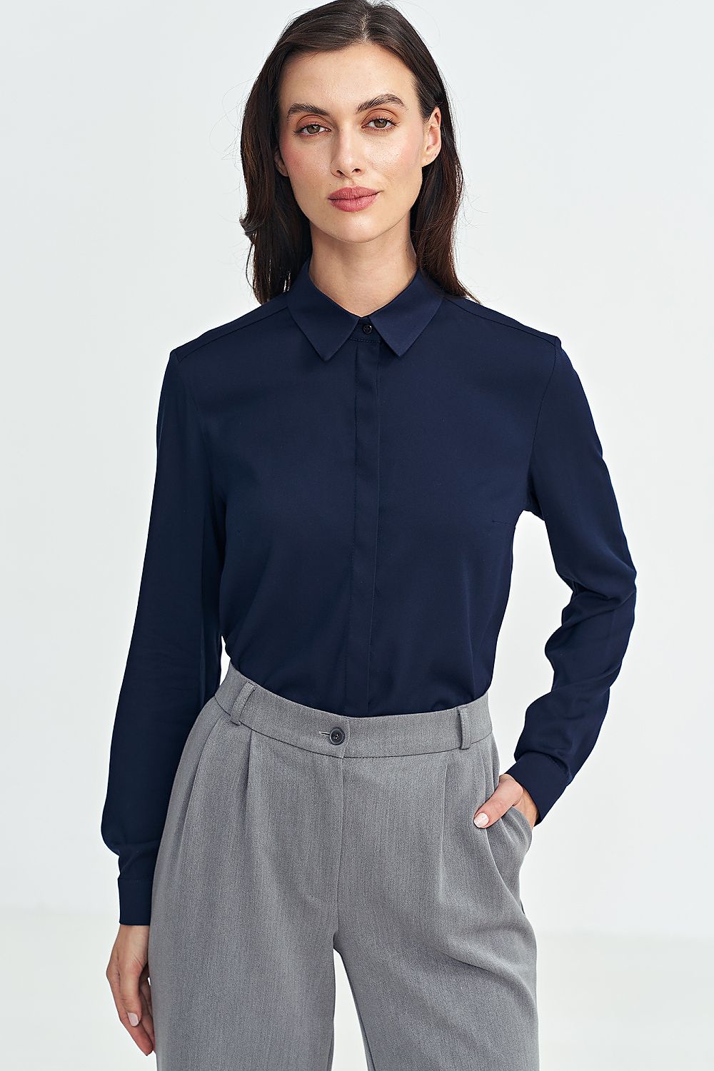 Fashionable women’s long sleeve shirt by Nife in various sizes, capturing the essence of luxury fashion with its sophisticated design and plush fabric.